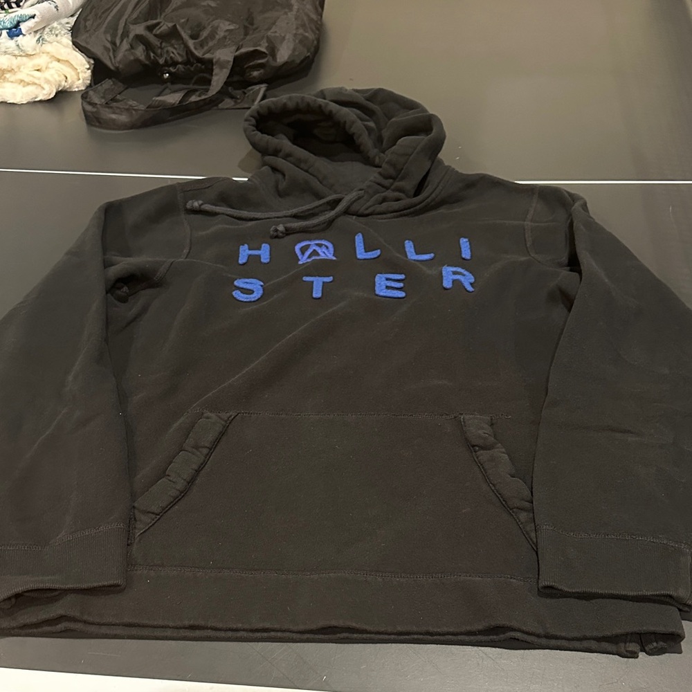 Hollister Men's Black Hoodie with Blue Lettering